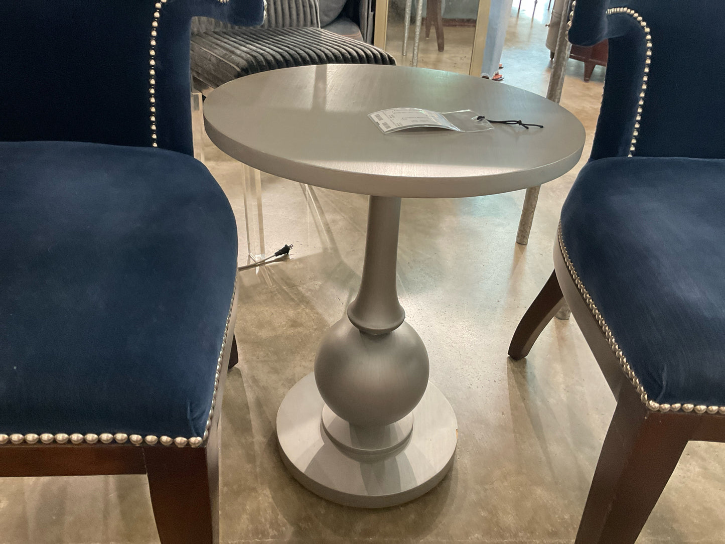 Round Silver Side Table by Swivel Chair