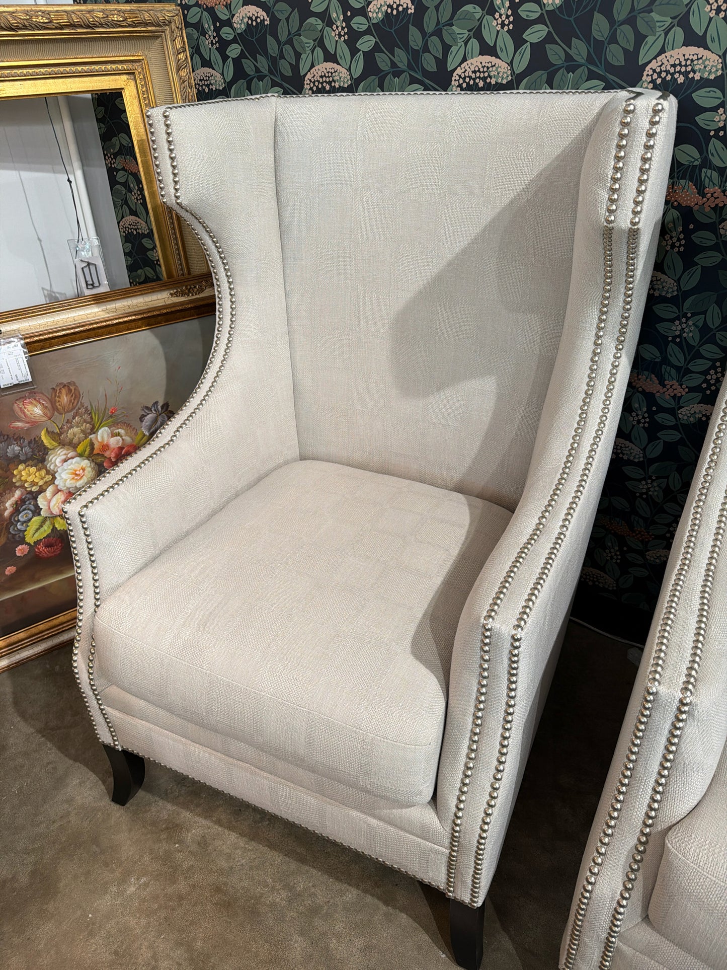 Cream Upholstered Silver Nailhead Trim Wingback Chair