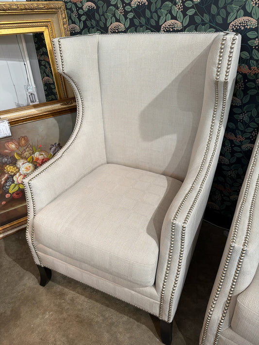 Cream Upholstered Silver Nailhead Trim Wingback Chair